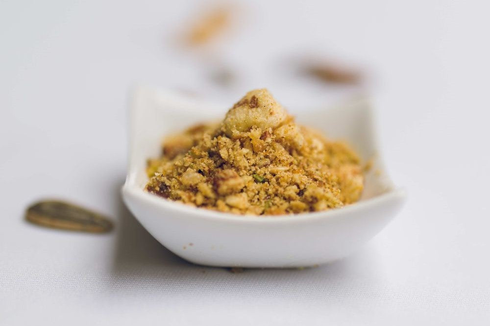 Small white bowl filled with panjeeri