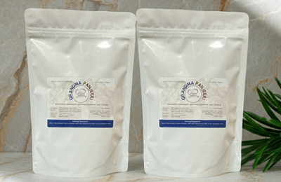 Two white panjeeri bags with a brand logo on a marble surface